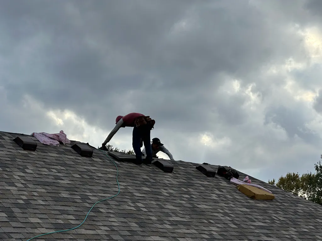 SRA Roofing team member on a residential roof inspection