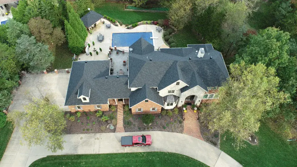 Aerial view of a completed multi-gable asphalt shingle roof on a Springfield-area home