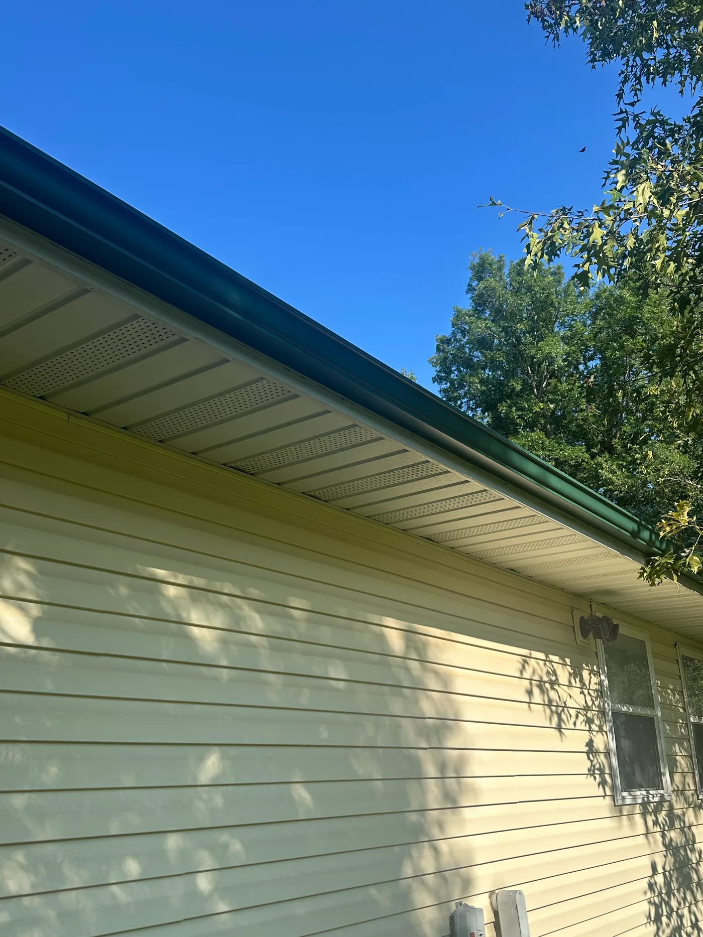 Residential gutter and soffit viewed from below during an inspection