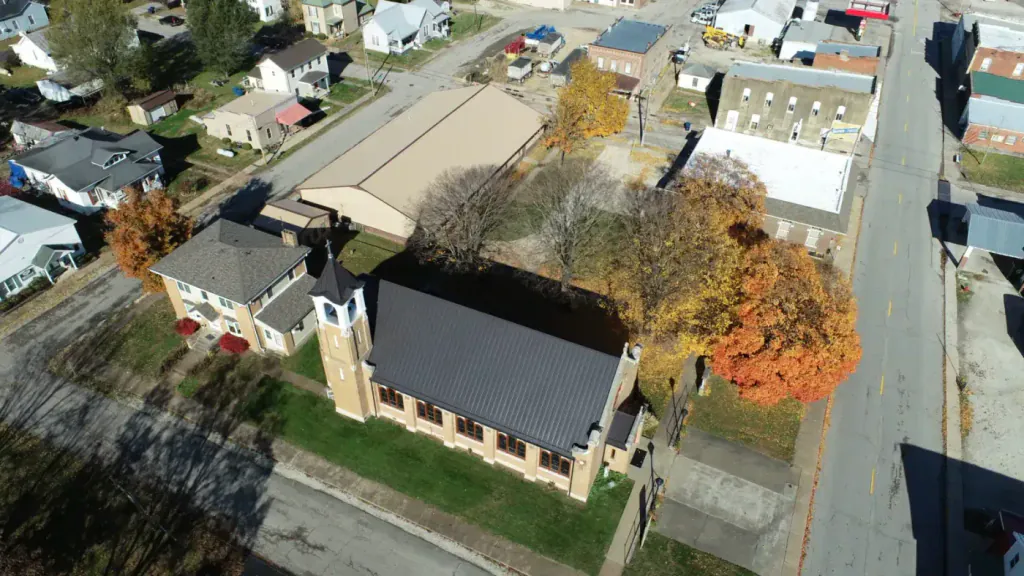Aerial view of a completed standing seam metal roof on a Springfield-area building